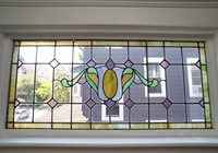 Original detail includes stained glass piano windows